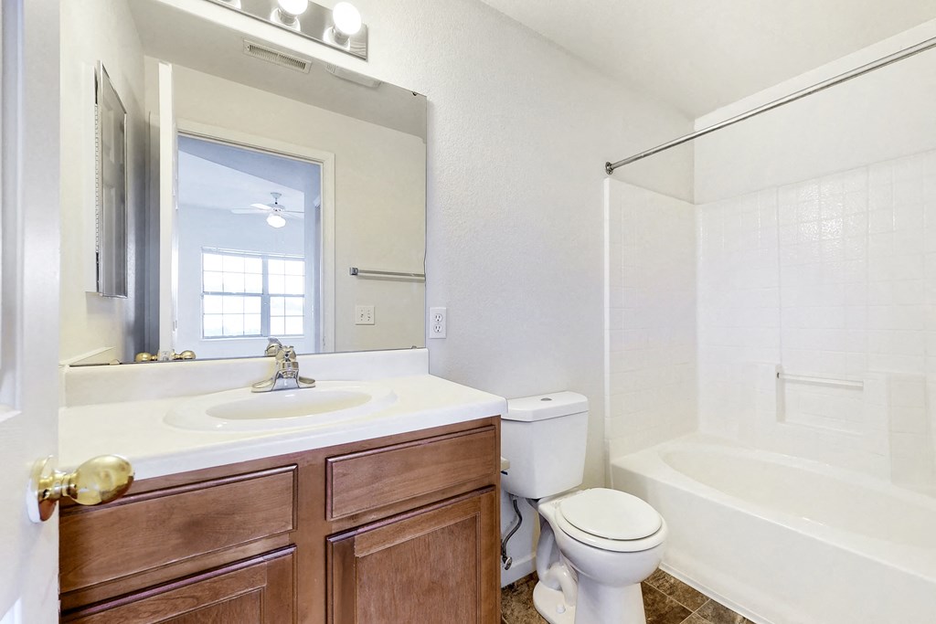 a bathroom with a sink toilet and a shower