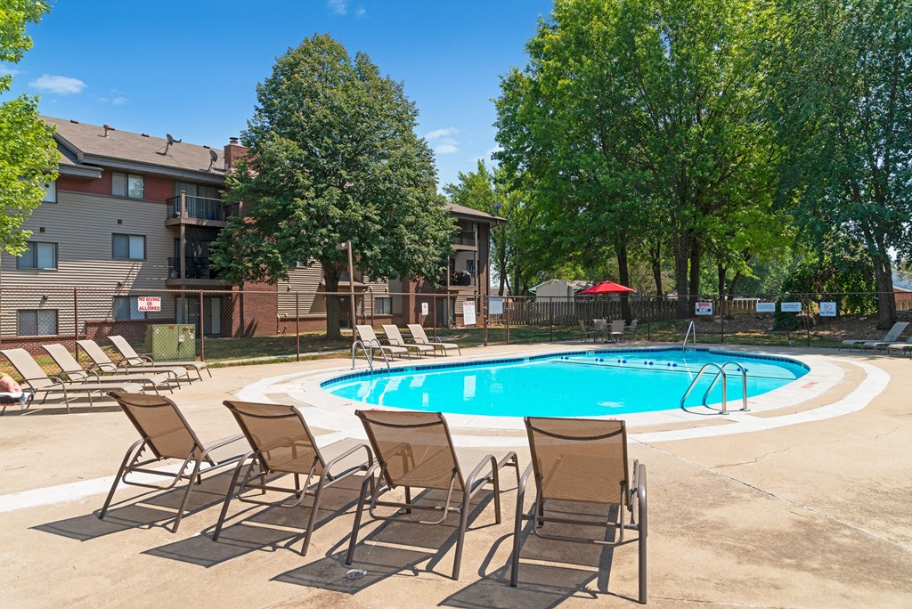 our apartments have a large pool and lounge chairs