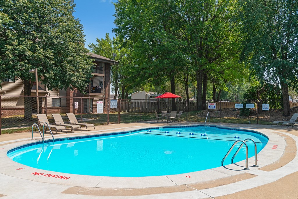 our apartments have a resort style pool with trees
