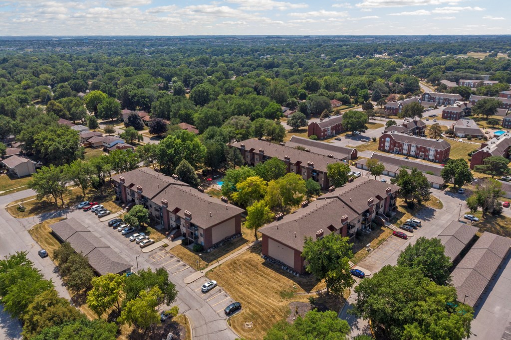 an aerial view of a neighborhood with houses and trees