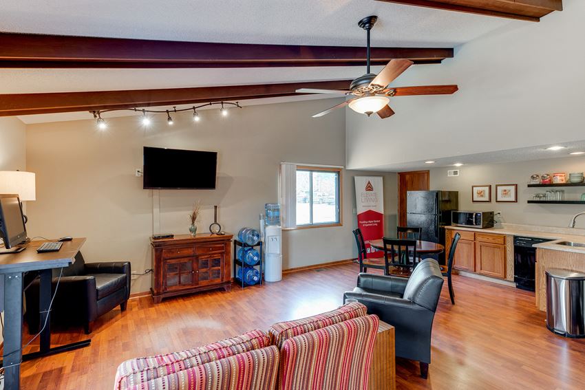 the living room is open to the kitchen and dining area
