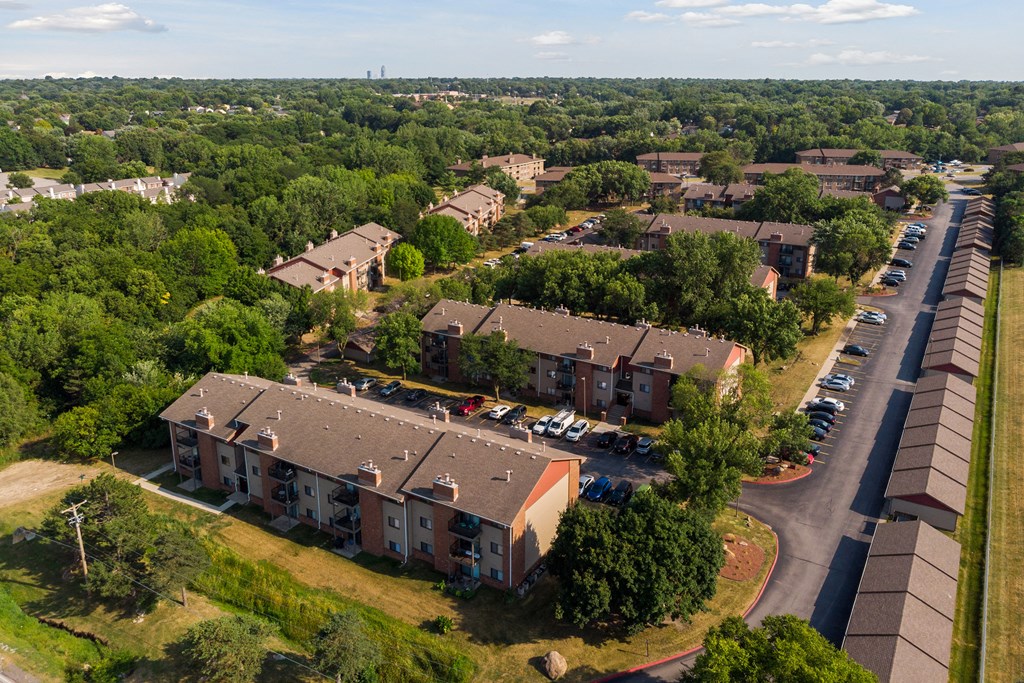 an aerial view of a neighborhood with houses and parking lot