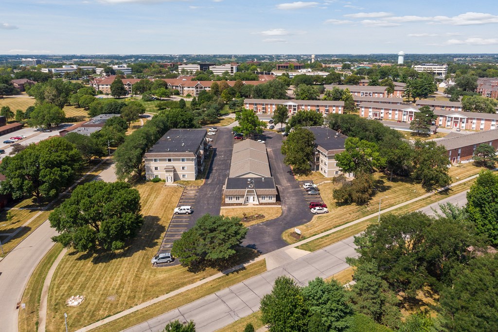 an aerial view of a city with houses and trees