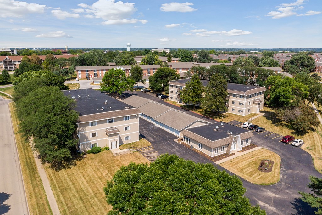 an aerial view of a group of buildings with roofs