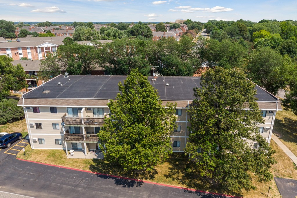 an aerial view of a building with a solar roof