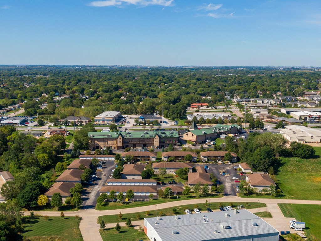 an aerial view of a suburb of a city with houses and trees