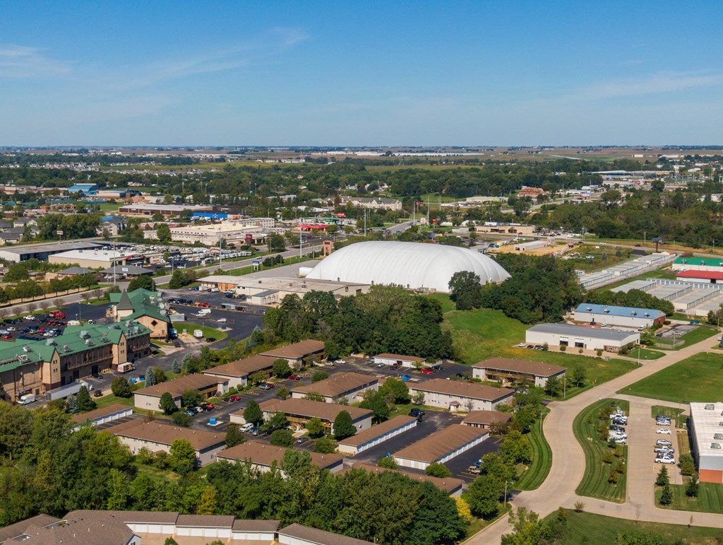 an aerial view of a city with a large dome in the background