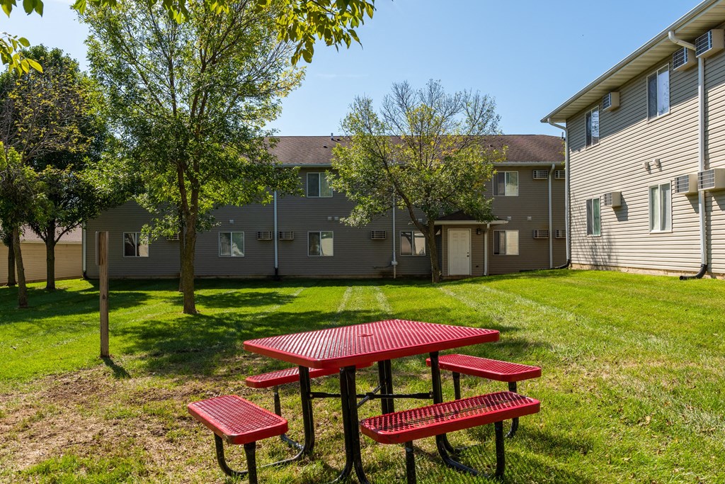 our apartments have a picnic area with benches and a table