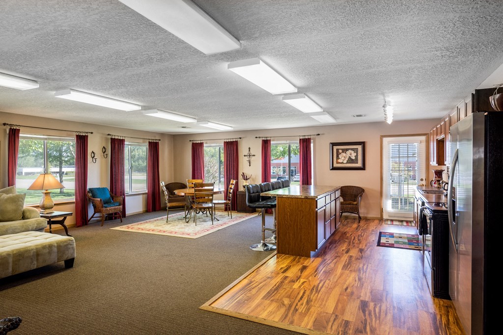 a living room with a kitchen and a dining room