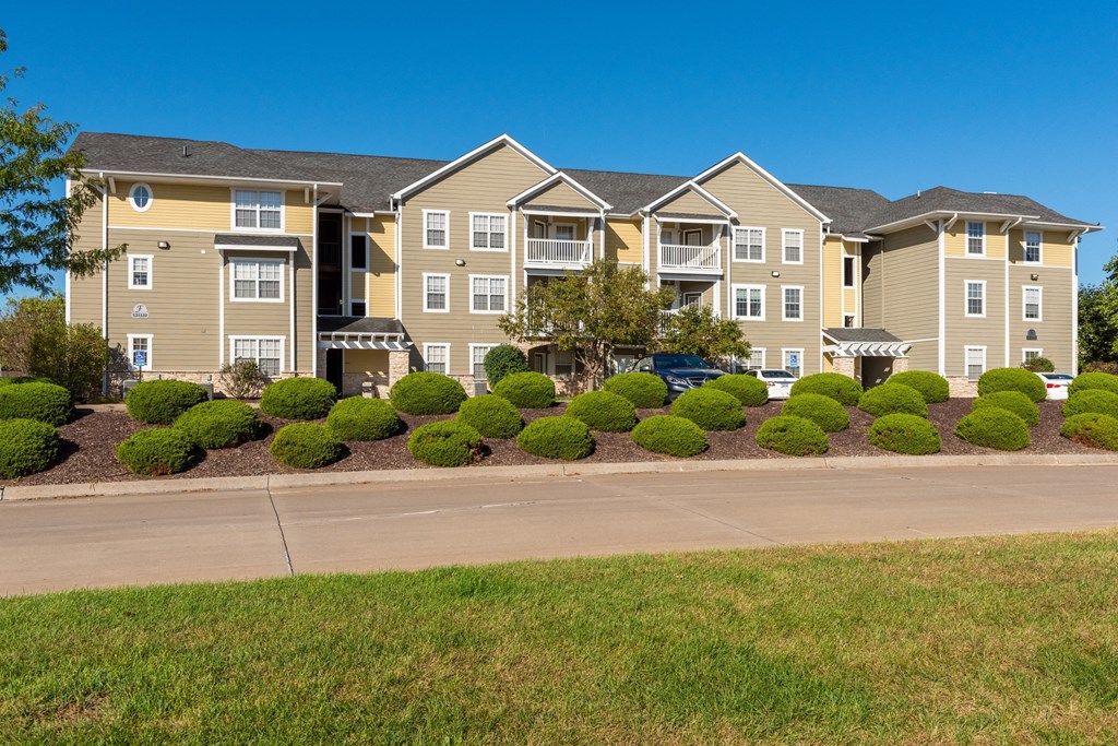 an apartment building on the side of a road