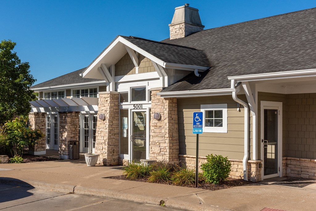 a house with a blue handicapped sign in front of it