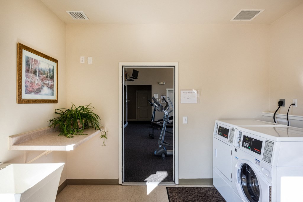 laundry room at the district at highland village apartments ca