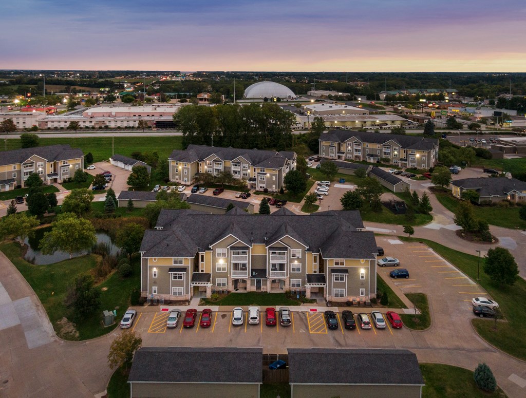 an aerial view of a neighborhood with houses and parking lot