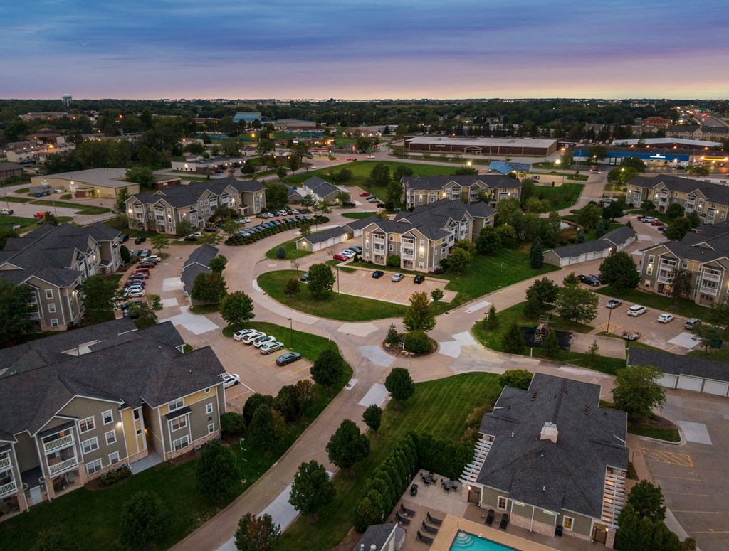 an aerial view of a neighborhood with houses and parking lots