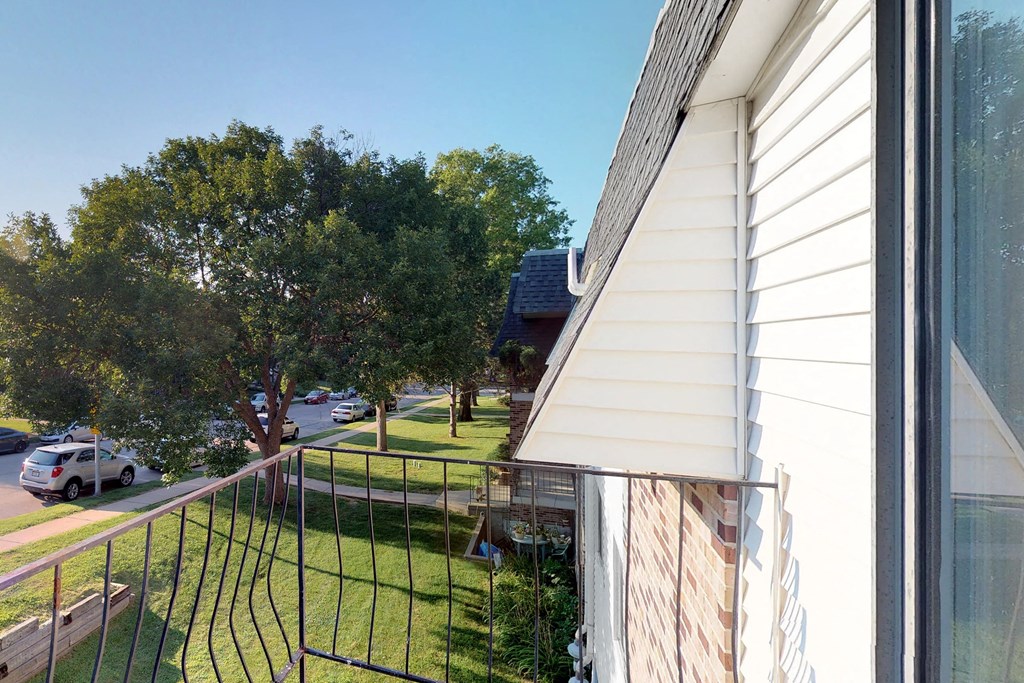 a view of the side of a house from a balcony