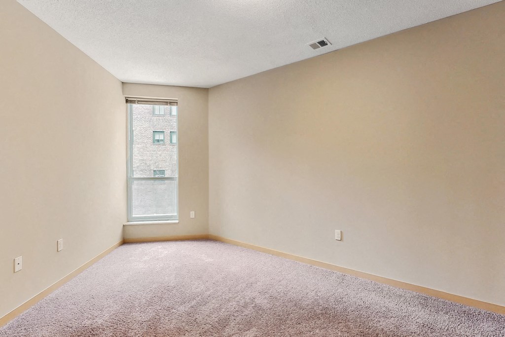 a room with carpet and a window