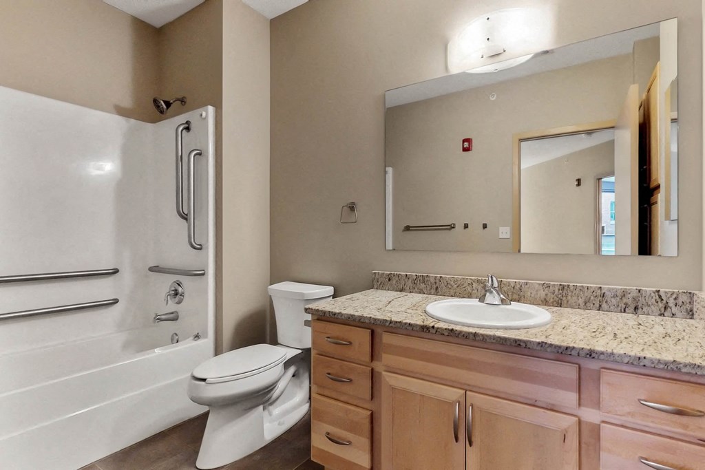 a bathroom with a sink toilet and a shower