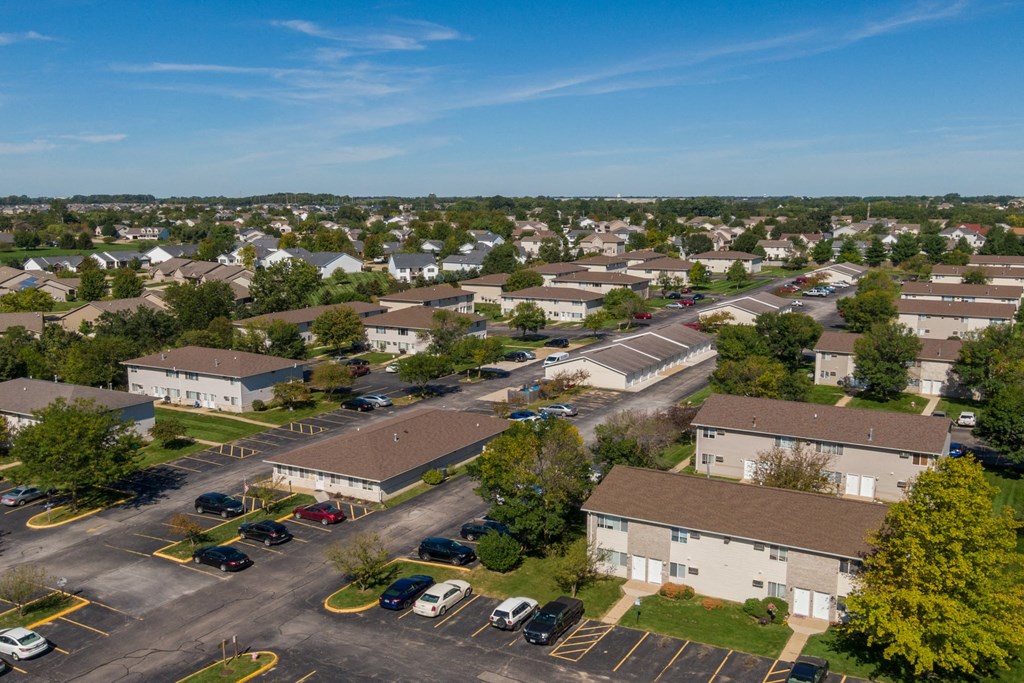 an aerial view of a neighborhood of houses in a parking lot