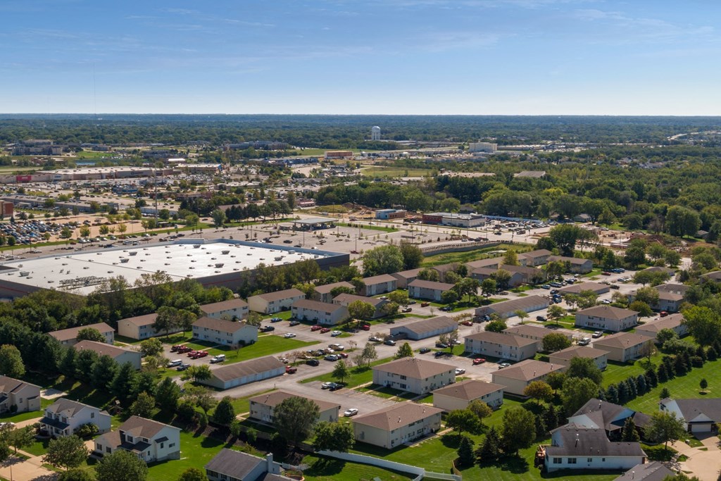 an aerial view of a neighborhood of houses and a parking lot
