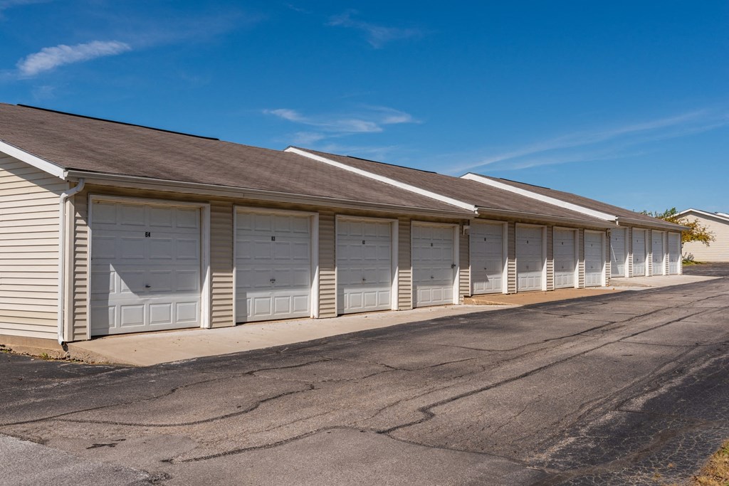 a row of garage doors on the side of a building