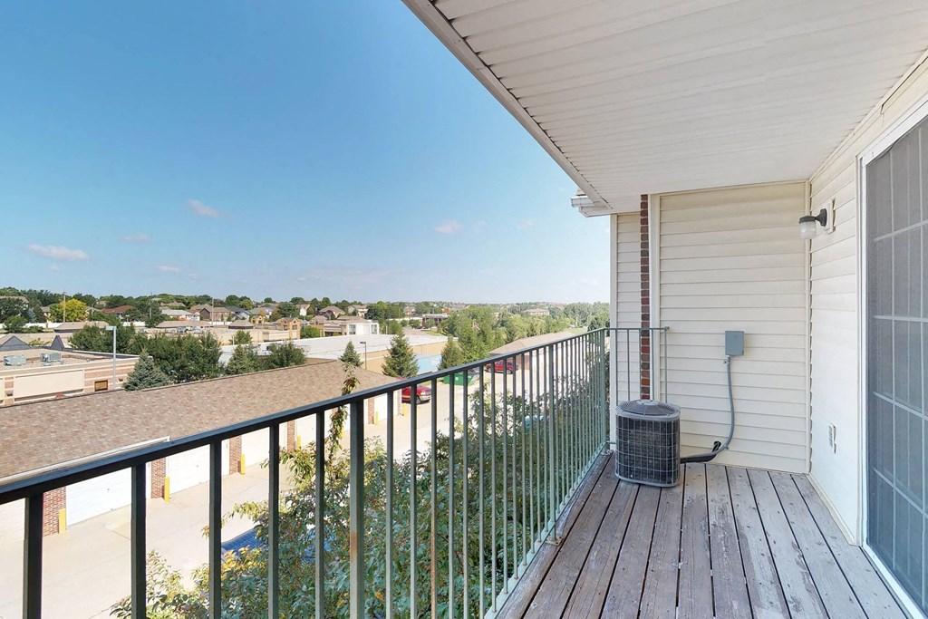 a balcony with a view of the city