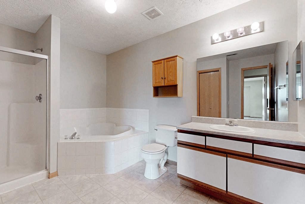 a bathroom with a sink toilet and a bath tub