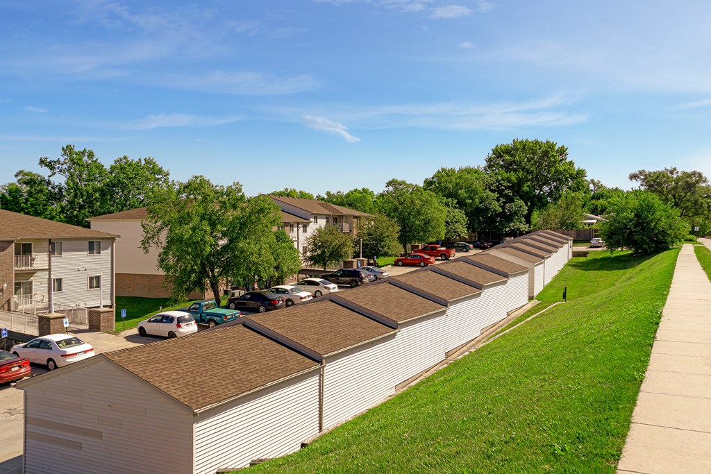 a row of houses with solar panels on the roofs