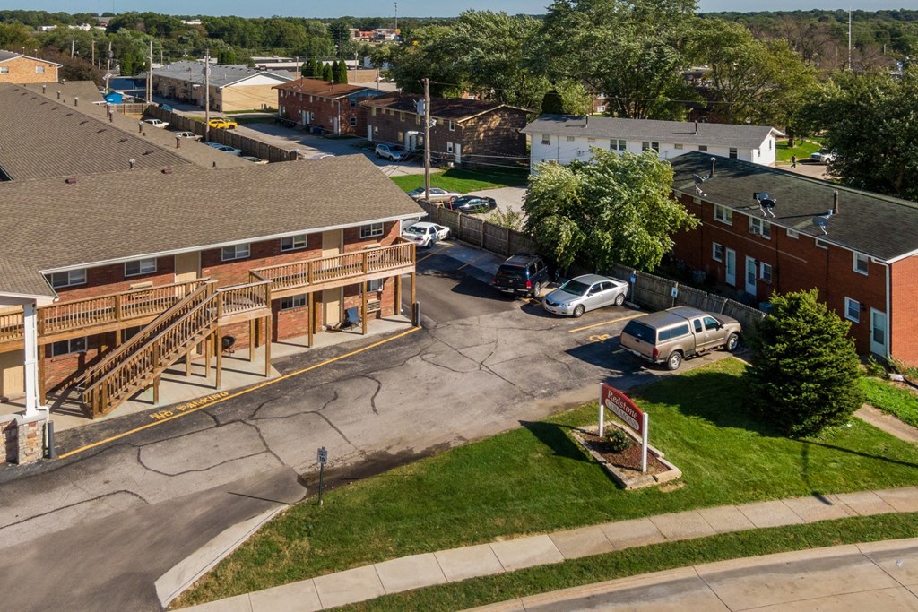 an aerial view of a city street with buildings and cars