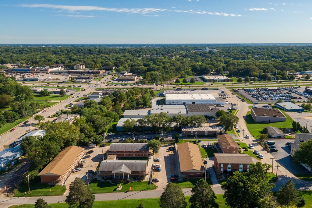 an aerial view of a city with buildings and trees
