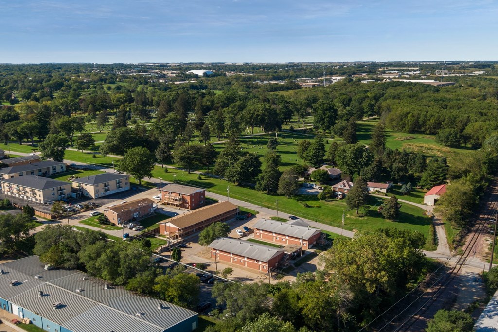an aerial view of the campus with buildings and trees