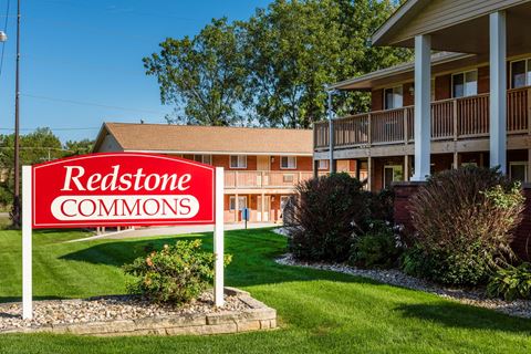 a redstone commons sign in front of a building