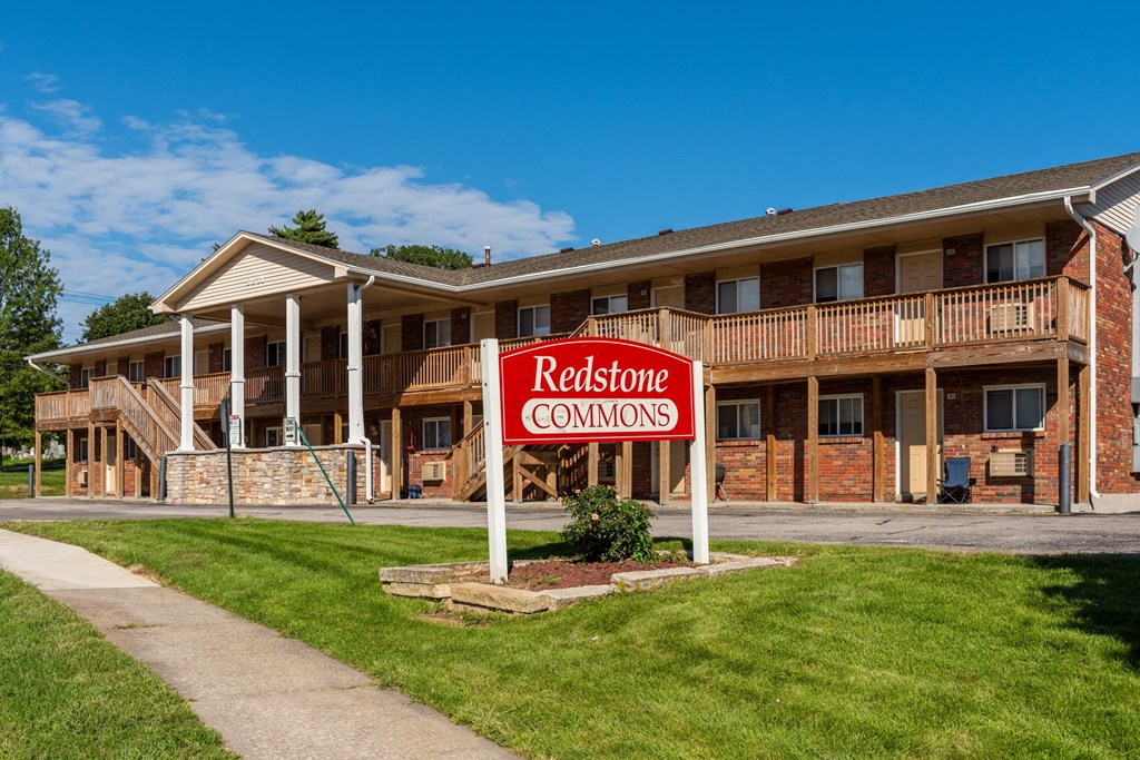 a redstone commons sign in front of a building