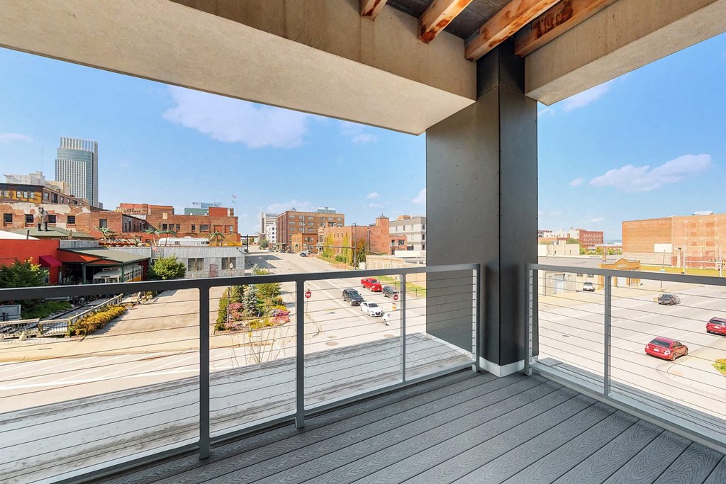 the view of the city from the balcony of a condo