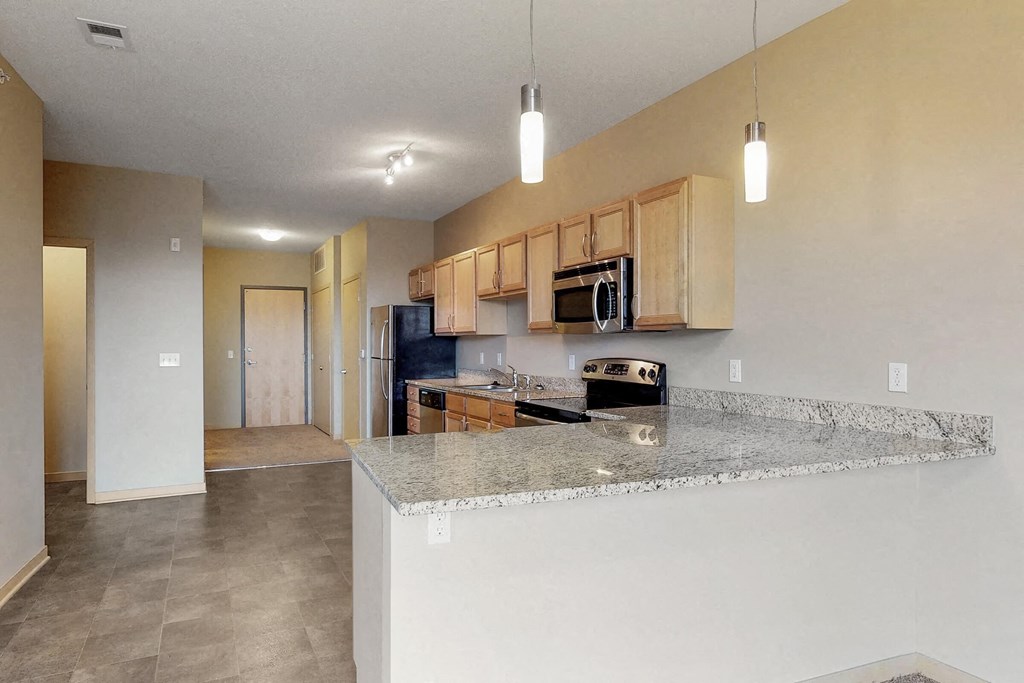 a kitchen with a granite counter top and a sink