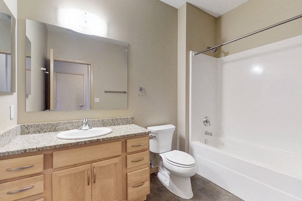 a bathroom with a sink toilet and a shower