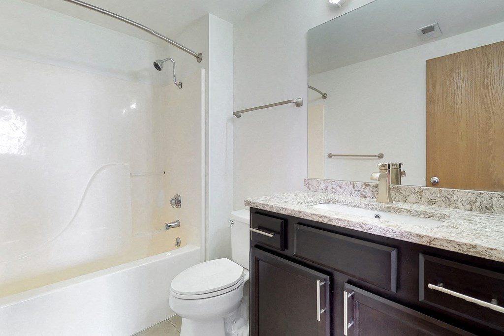 a bathroom with a sink toilet and a shower