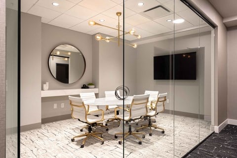a meeting room with a table and chairs at 220 Meridian, Indiana, 46204