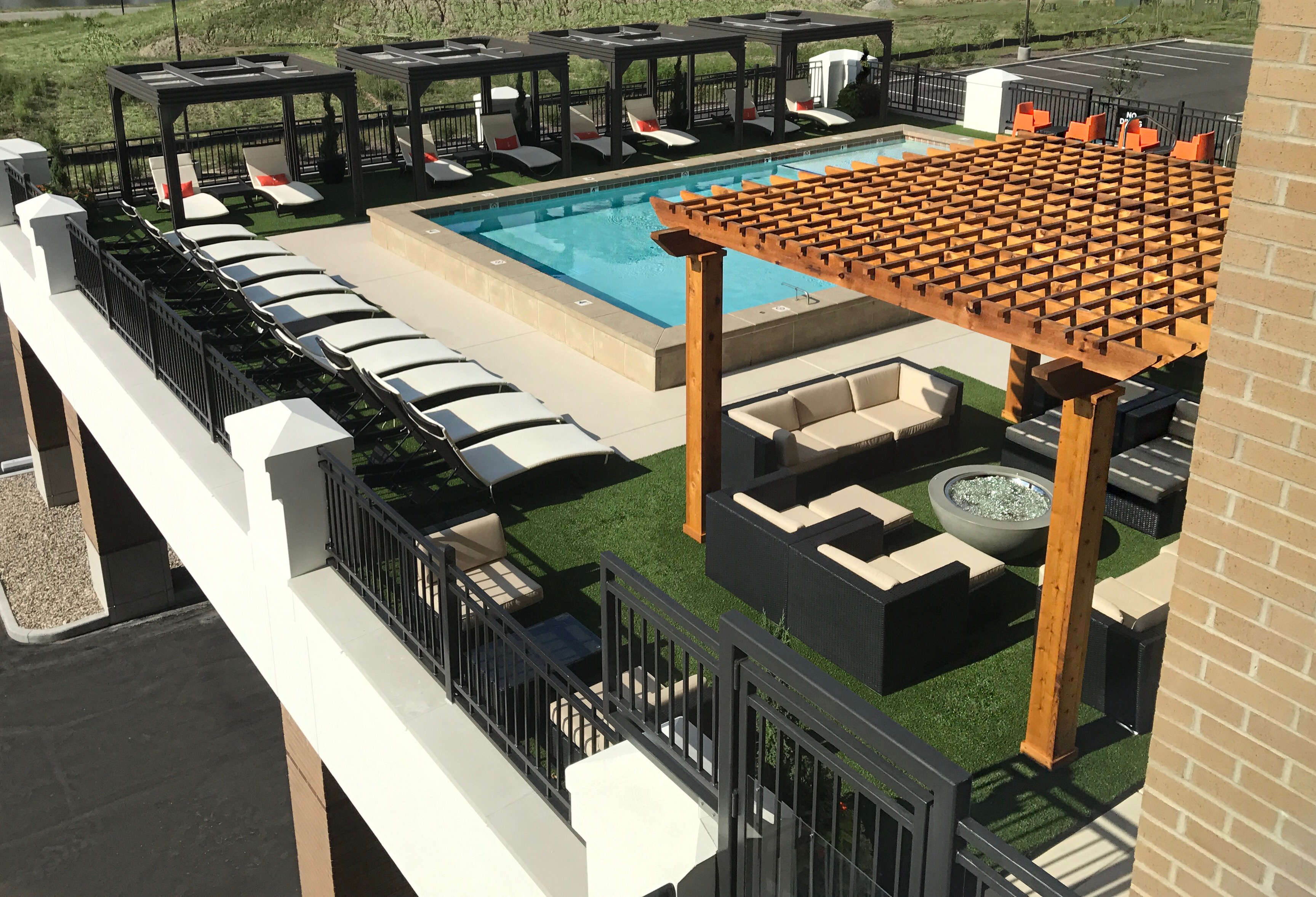 a rendering of the pool and seating area of a hotel