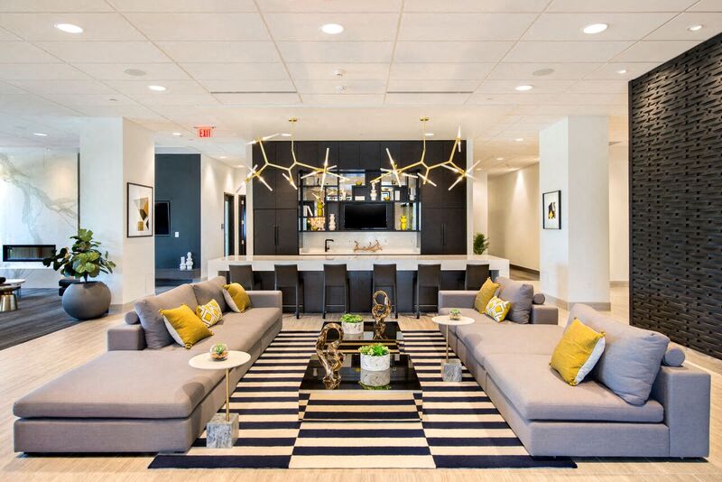 a large living room with couches and a table