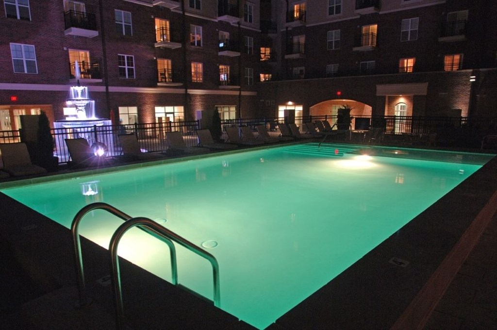 the pool is lit up at night at night