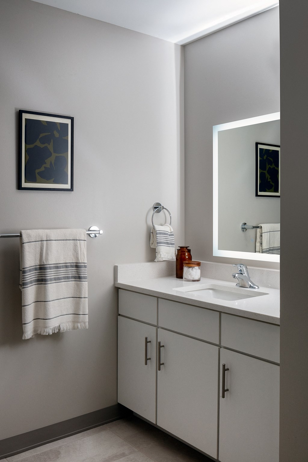 a small bathroom with a sink and a mirror