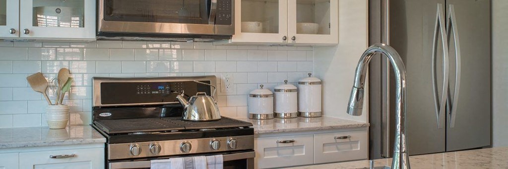 a kitchen with a stove and a microwave