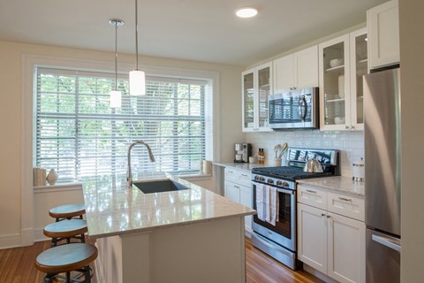 a kitchen with a sink and a counter top