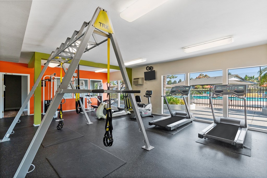 a room with gym equipment and two treadmills at Terramonte Apartment Homes, Pomona, 91767