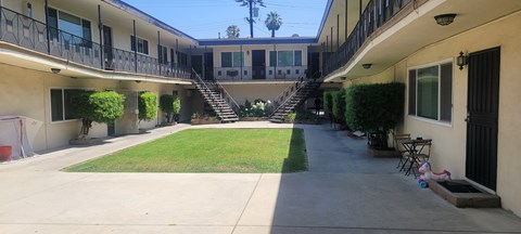 A courtyard with a staircase in the middle.