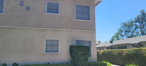 A beige building with the number 28 on it.