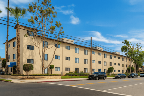A building with a blue sign in front of it.