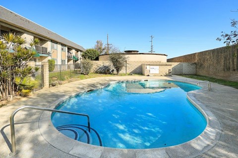 A small pool with a metal railing.