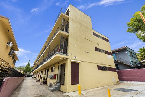 A yellow building with the number 2401 on it.