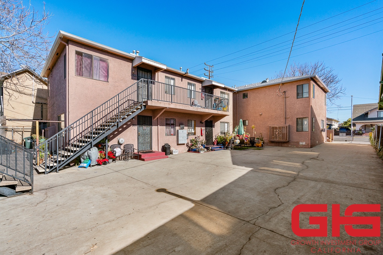 A sunny day at a residential complex with a clear blue sky.